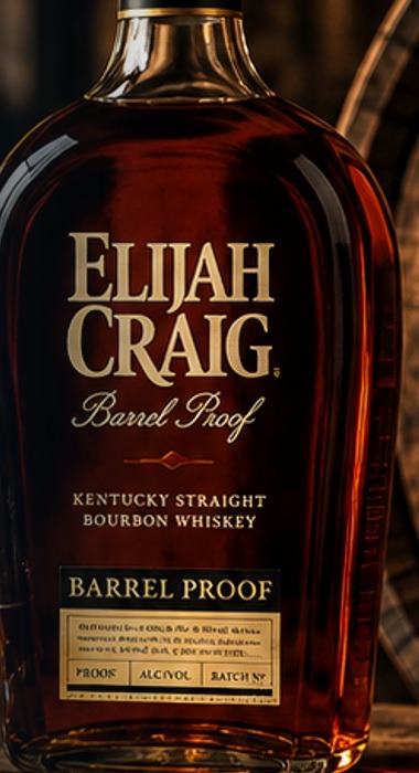 A bottle of Elijah Craig Barrel Proof bourbon beside a Heaven Hill Distillery barrel